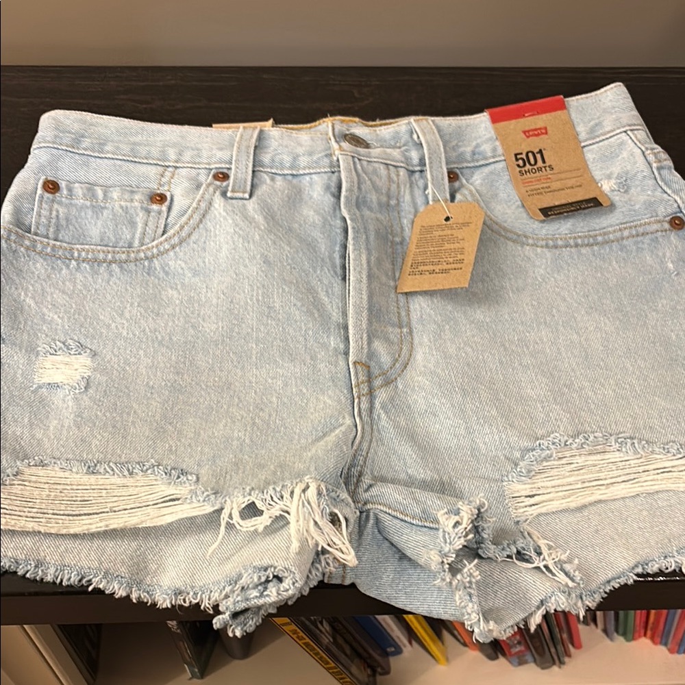 Levi's Blue Jean Shorts with Distressed Hem and High-Waisted Fit